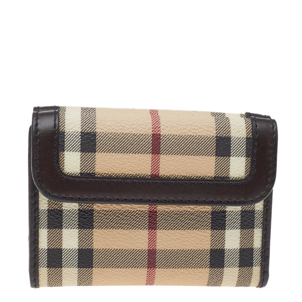 Store your monetary essentials effortlessly in this sturdy wallet. Crafted from Haymarket check coated canvas and leather, this Burberry creation comes in a trifold style with ample space for your ID, cash, and cards.