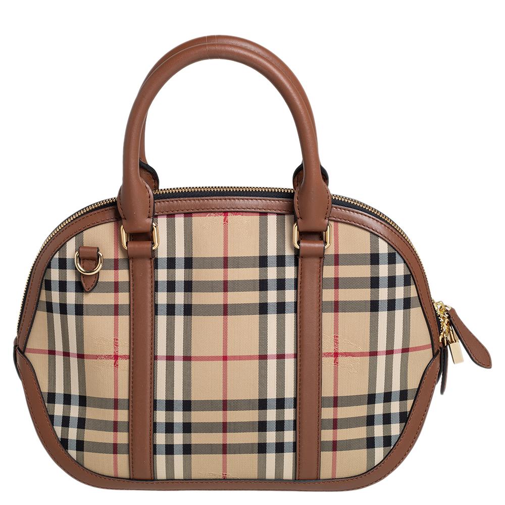Finely crafted and richly designed, this Burberry piece is surely a must-have in every woman's collection. It is made from Haymarket Check canvas as well as brown leather and features two handles and a spacious interior. Ideal for any day, this bag