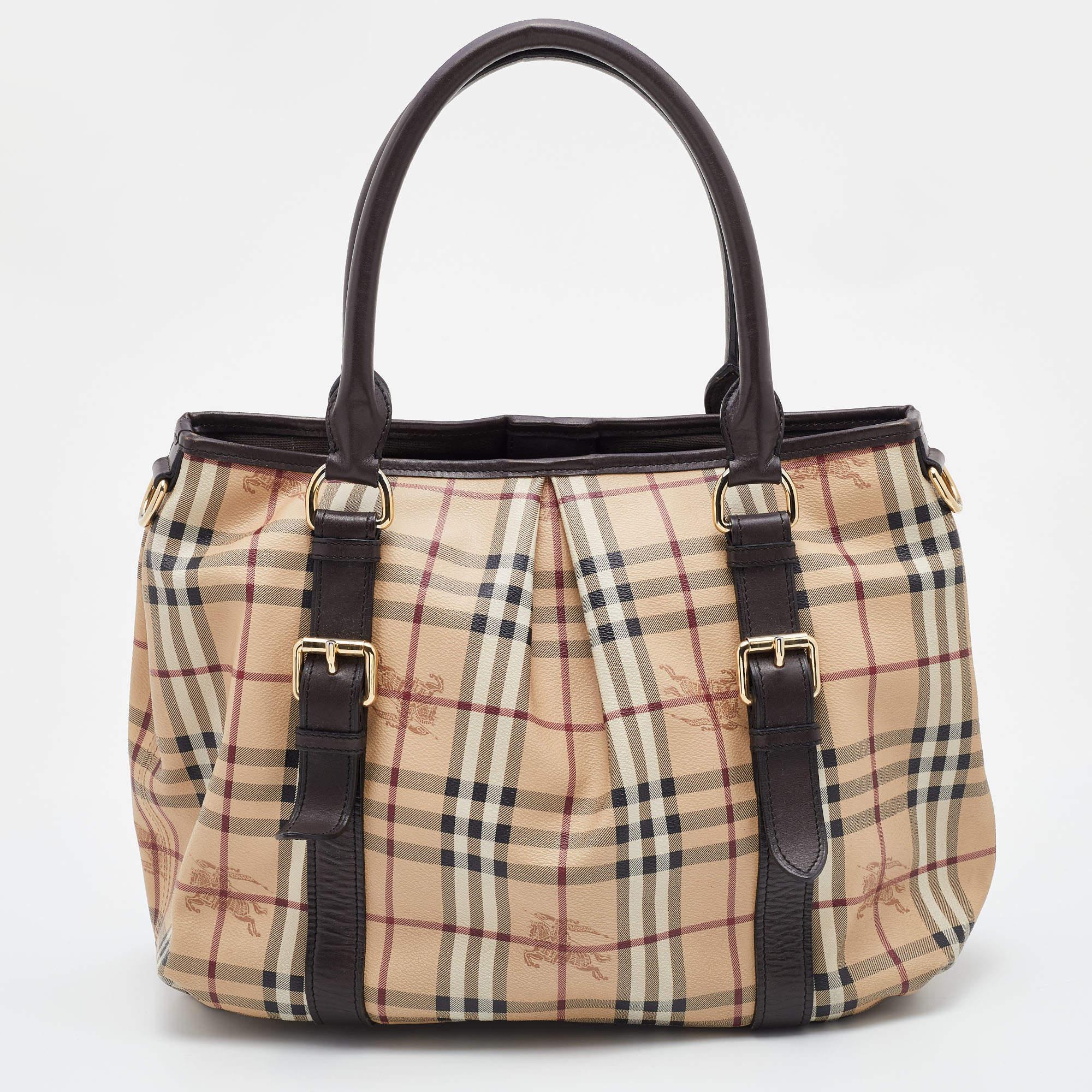 Striking a beautiful balance between essentiality and opulence, this tote from the House of Burberry ensures that your handbag requirements are taken care of. It is equipped with practical features for all-day ease.

Includes: Detachable Strap

