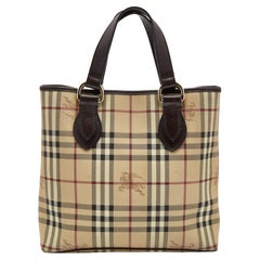 Bolso Burberry Regent de lona revestida y piel Haymarket beige/marrón