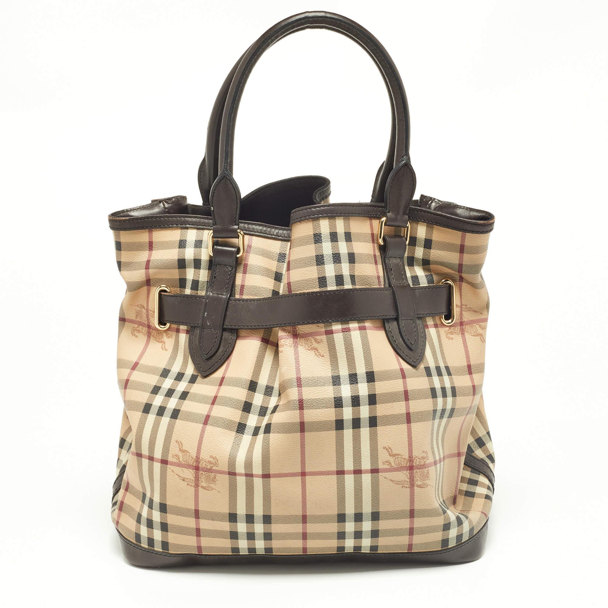 Carry everything you need in style thanks to this Burberry Haymarket Check tote. Crafted from the best materials, this is an accessory that promises enduring style and usage.

