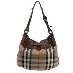 Burberry: borsa in pelle beige/marrone e tela a quadri Nova.