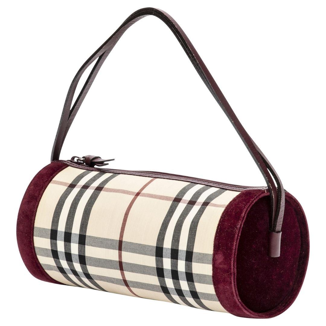 A classic beige and burgundy canvas Burberry with a silver zipper, featuring the iconic check plaid and a logo jacquard interior. We love the velvet detailing as it feels so festive for the holidays.

SPECIFICS
Length: 9.8
Width: 4
Height: 4
Strap