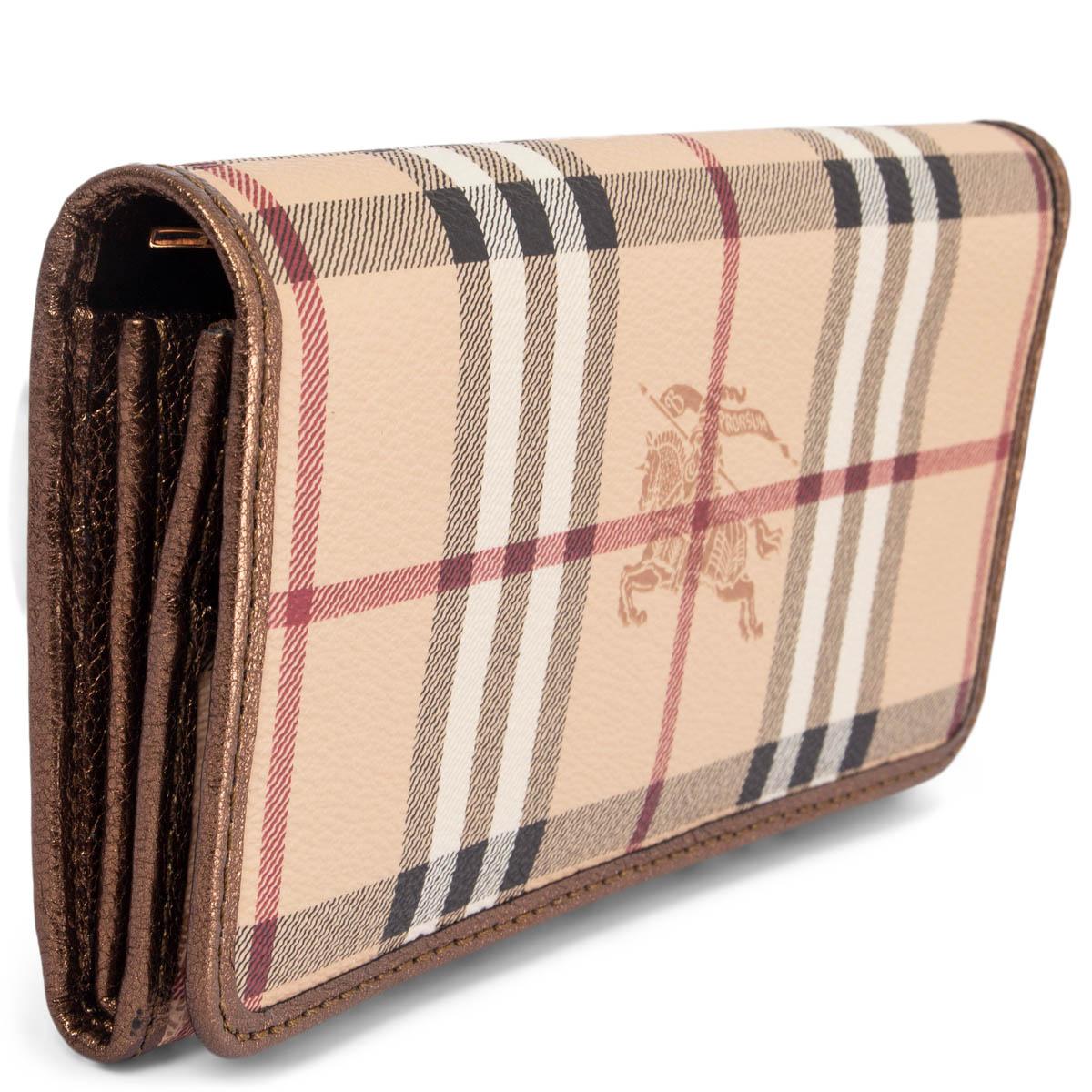 100% authentic Burberry Prorsum classic check wallet in beige, red, black and white coated canvas with bronze leather trim and lining. Opens with a push-button to 12 credit card slots, a big zipper coin pocket, 2 bill compartments and 4 slip