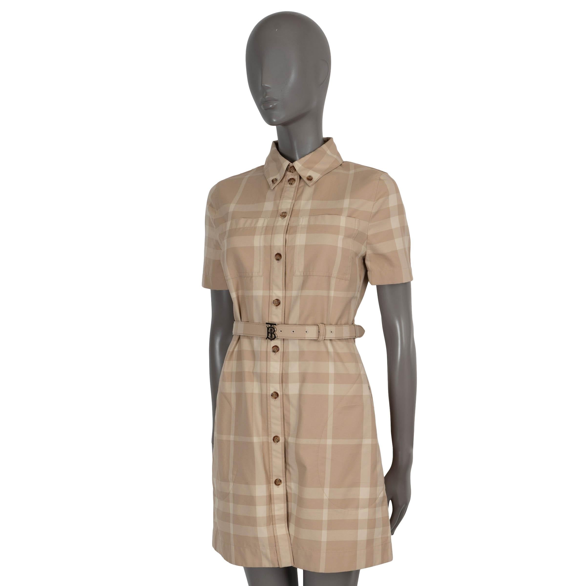 100% authentic Burberry belted mini dress in plaid print beige cotton (100%). The design features a slightly flared silhouette, short sleeves, slit pockets on the side, two chest pockets and is buttoned throughout the front. Unlined. Has been worn