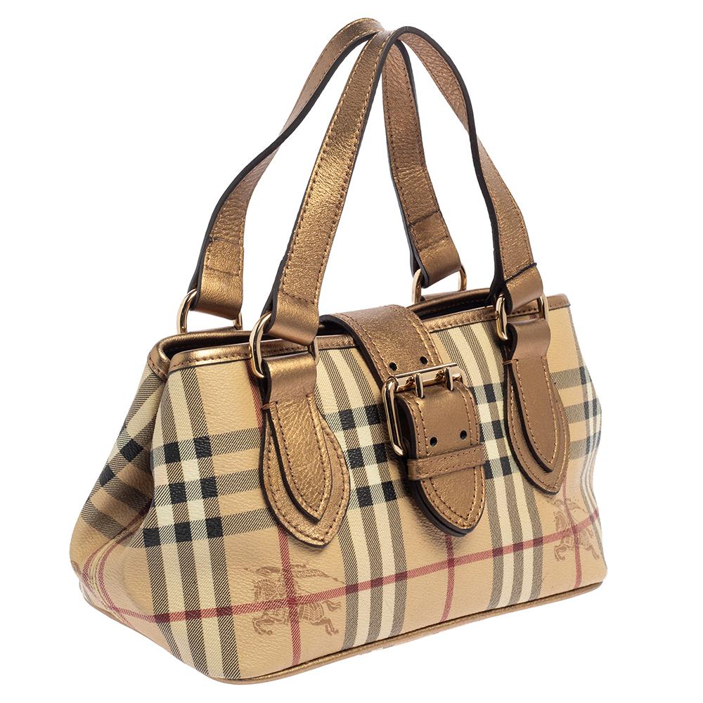 A Burberry bag should definitely be a part of your wardrobe if you love high-quality and classic designs. This Eden bag, made of Haymarket Check coated canvas and leather, will be a fine addition. It has dual top handles and a canvas-lined interior.