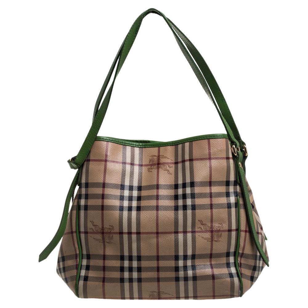 The Canterbury tote is one of Burberry's most loved bags. This here is crafted from Haymarket Check canvas and green leather. It comes with dual leather handles and a canvas-lined interior sized to hold all your daily necessities. Simple in design,