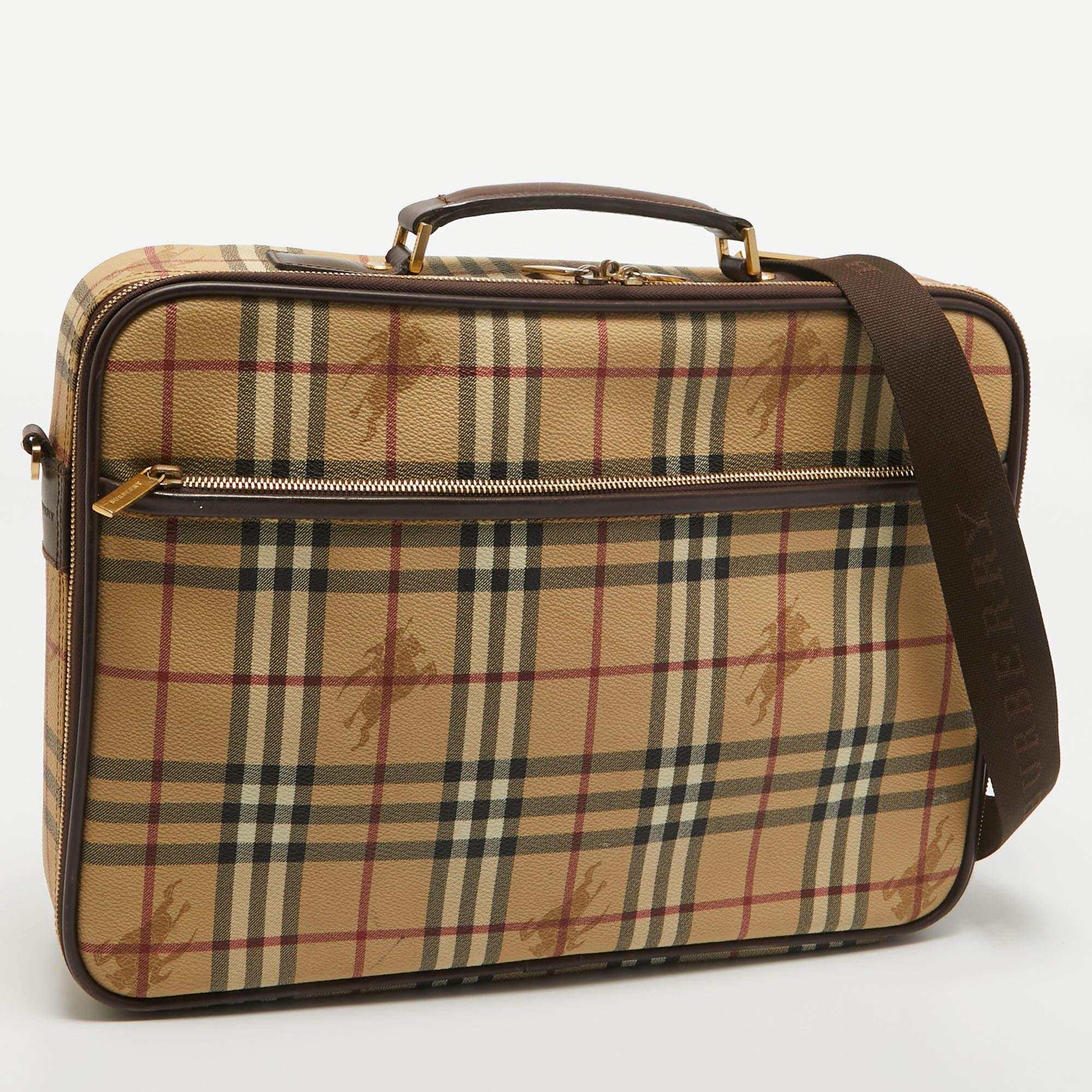 The Burberry briefcase is a sophisticated accessory featuring the iconic Burberry check pattern on durable coated canvas. With a timeless beige color, leather trims, and a spacious interior, this briefcase seamlessly combines style and