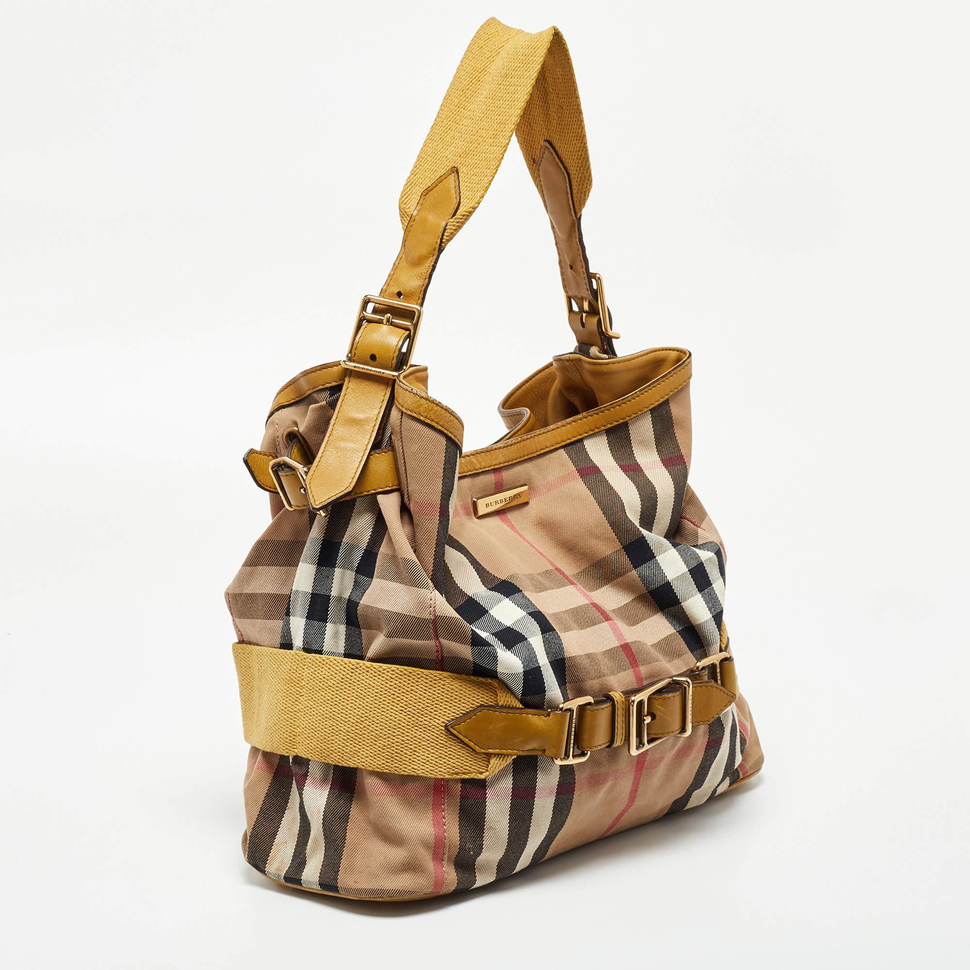 Indulge in luxury with this Burberry bag. Meticulously crafted from premium materials, it combines exquisite design, impeccable craftsmanship, and timeless elegance. Elevate your style with this fashion accessory.

