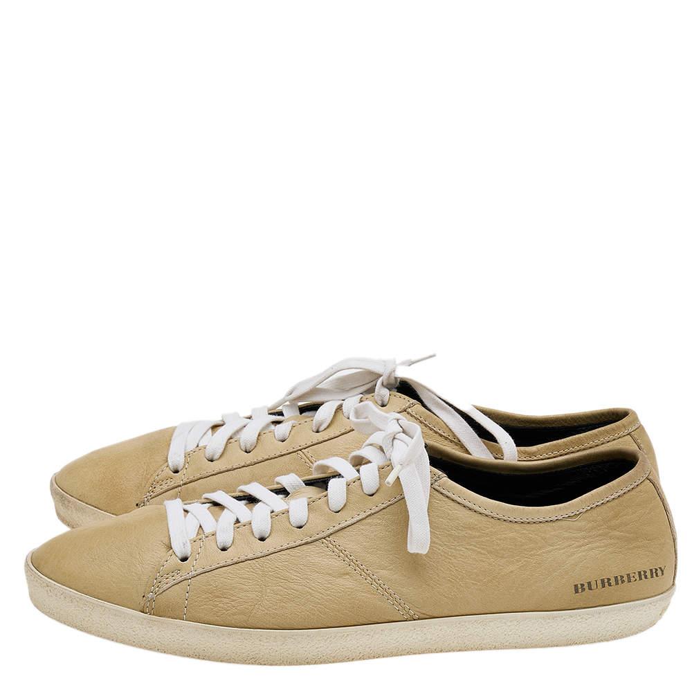 Coming in a classic low-top silhouette, these Burberry sneakers are a seamless combination of luxury, comfort, and style. They are made from leather in a beige shade. These sneakers are designed with logo details, laced-up vamps, and comfortable