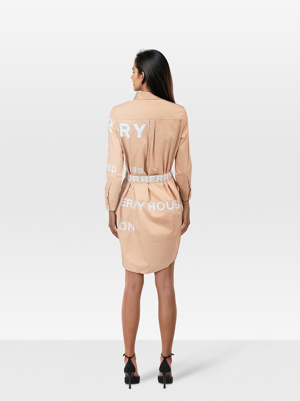 CONDITION is Very¬†Good. Hardly any visible wear to the dress is evident on this used Burberry designer resale item.
 
 
 
 Details
 
 
 Beige
 
 Cotton
 
 Shirt dress
 
 Logo print
 
 Knee length
 
 Long sleeves
 
 Button up fastening
 
 Belted
 

