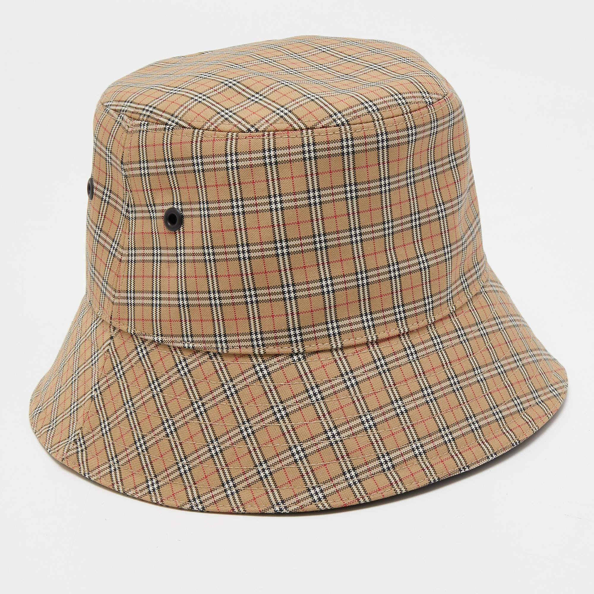 Bucket hats are one accessory that can complete a stylish look. Made in Italy from quality materials, this Burberry bucket hat flaunts a vintage checked exterior while the brand label is neatly stitched inside. This piece is trendy and quite