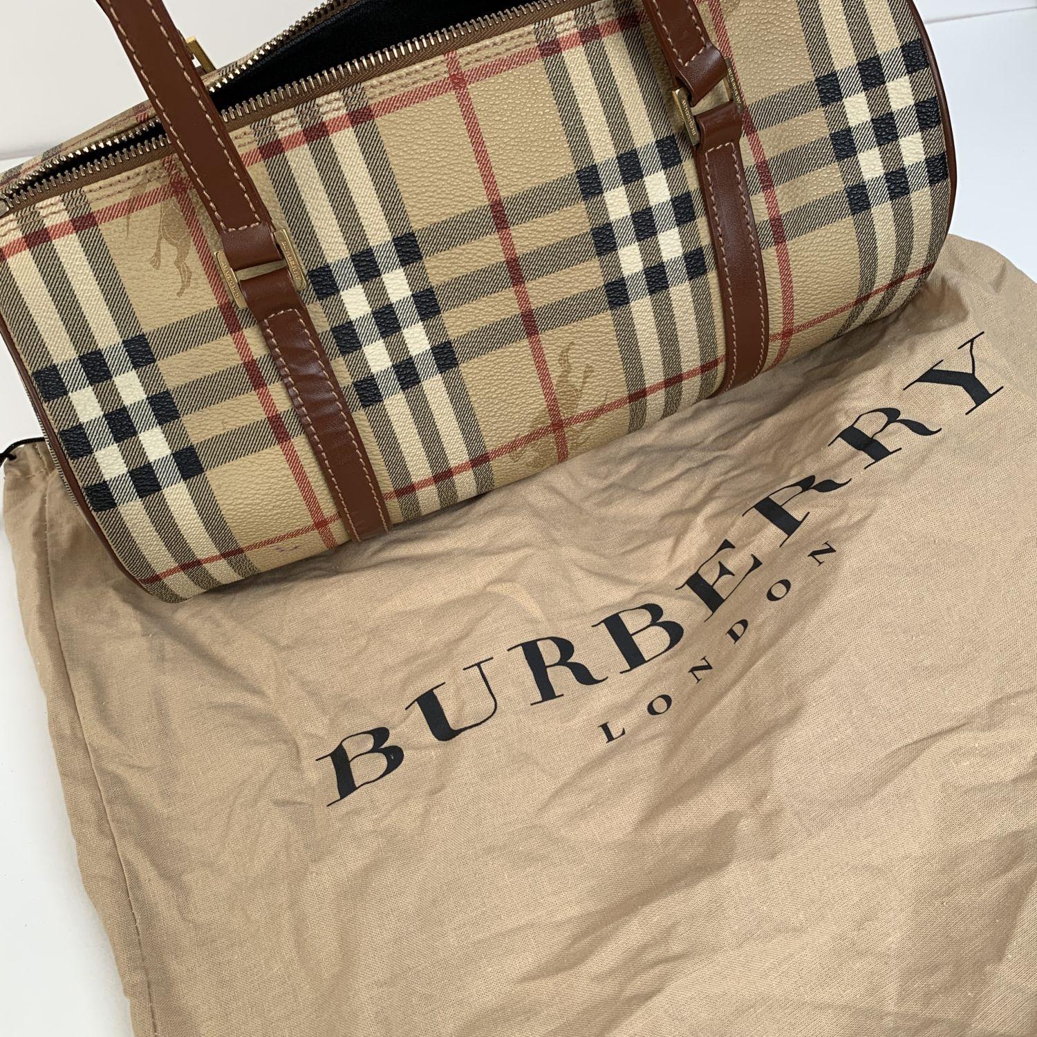 This beautiful Bag will come with a Certificate of Authenticity provided by Entrupy, leading International Fashion Authenticators. The certificate will be provided at no further cost.

- Burberry Beige Nova Check Canvas Rounded Shape Handbag
-
