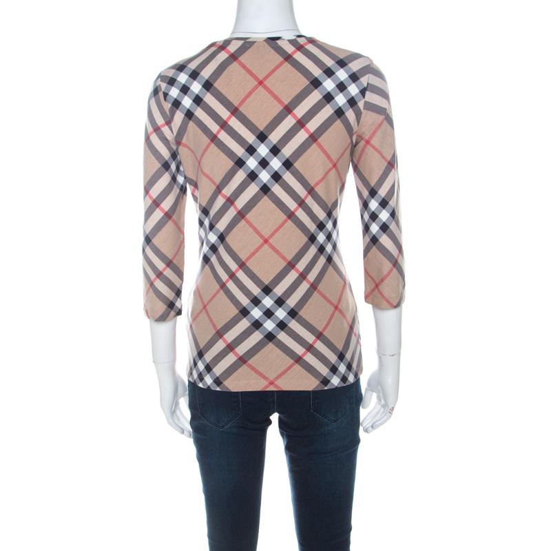 Made to fit right into the mood of the season as well as add to your casual style is this top from Burberry. The top is tailored from a cotton blend and styled with their Nova Check all over, three-quarter sleeves and a V-neckline.

Includes: The