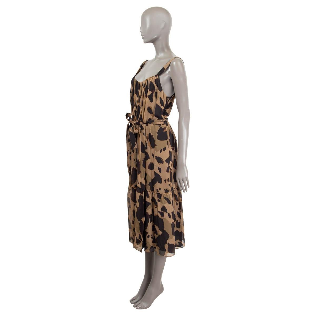 100% authentic Burberry Darcie camouflage dress in olive green, brown and black silk (100%). Double lined in black silk. Features a silk belt in similar pattern, thick strap sleeves, a flowy A-line cut and opens with a concealed zipper on the side.