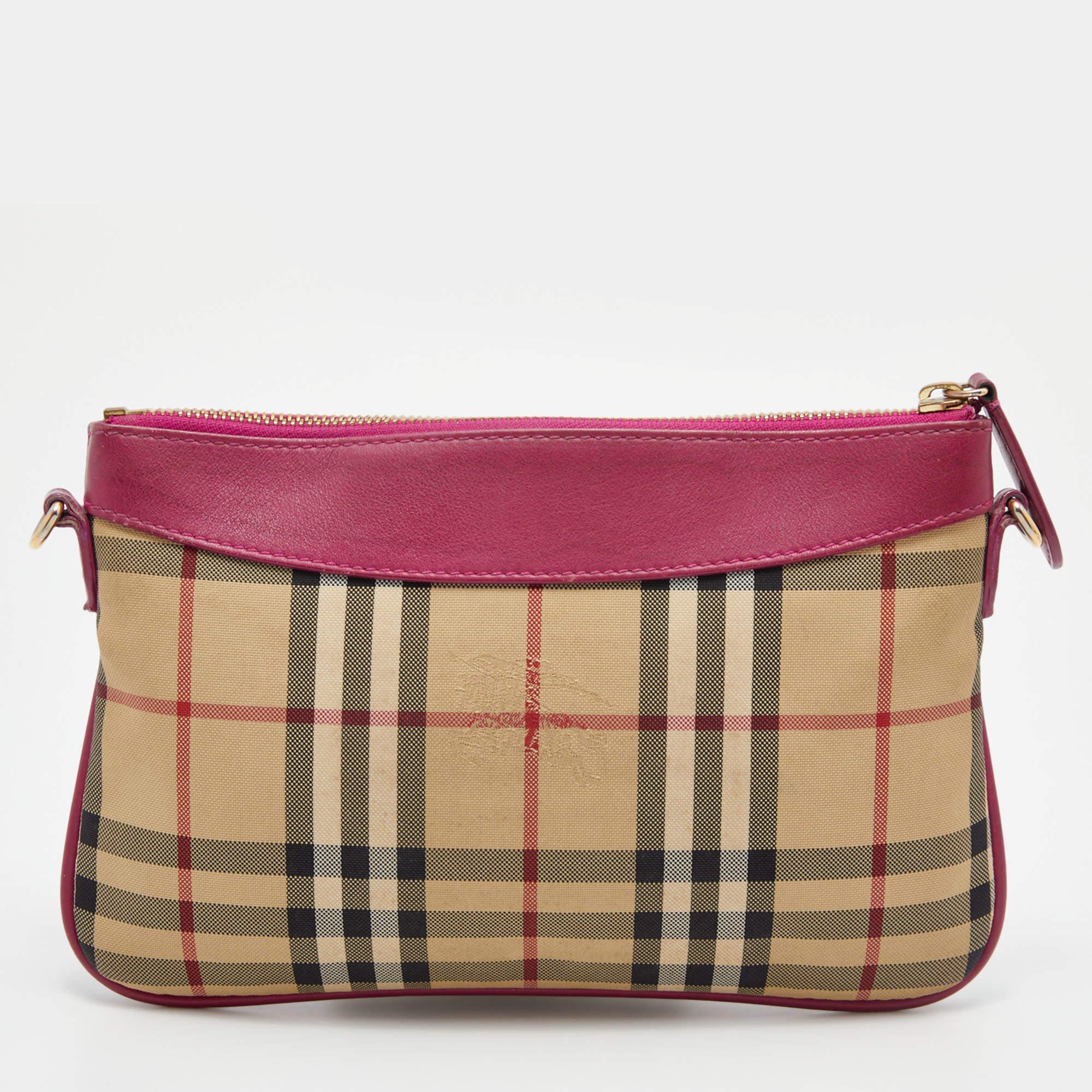 Crafted from Horseferry check-canvas, this Burberry Peyton bag is a valuable and reliable accessory. It features the brand signature on the front, gold-tone hardware, and a shoulder strap. Lined with fabric and leather, the interior is spacious