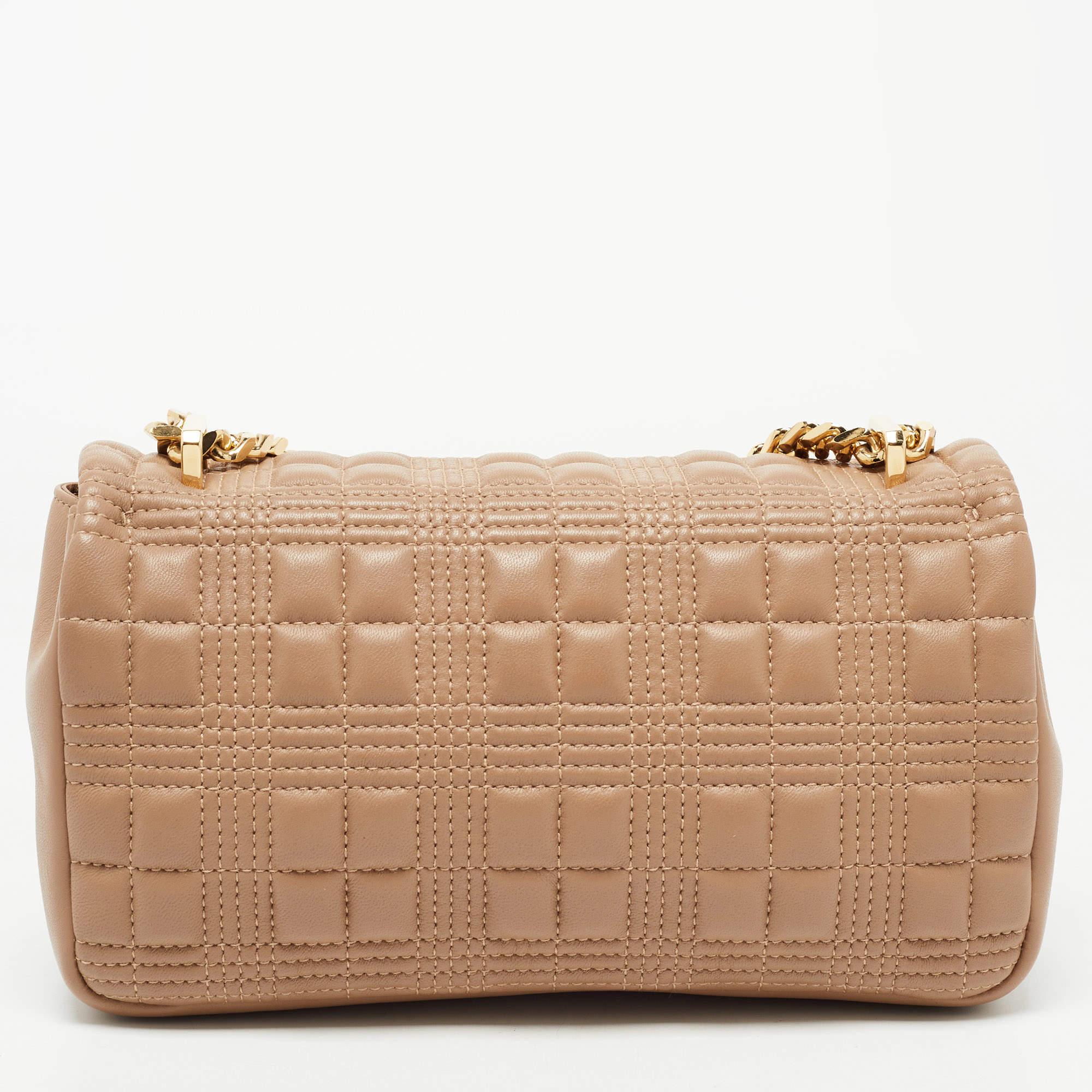 Recognized to add elements of elegance and high-end fashion into its pieces, this Lola shoulder bag from Burberry does complete justice to the brand's heritage and aesthetic. Externally, it is made using quilted leather with a gold-toned accent