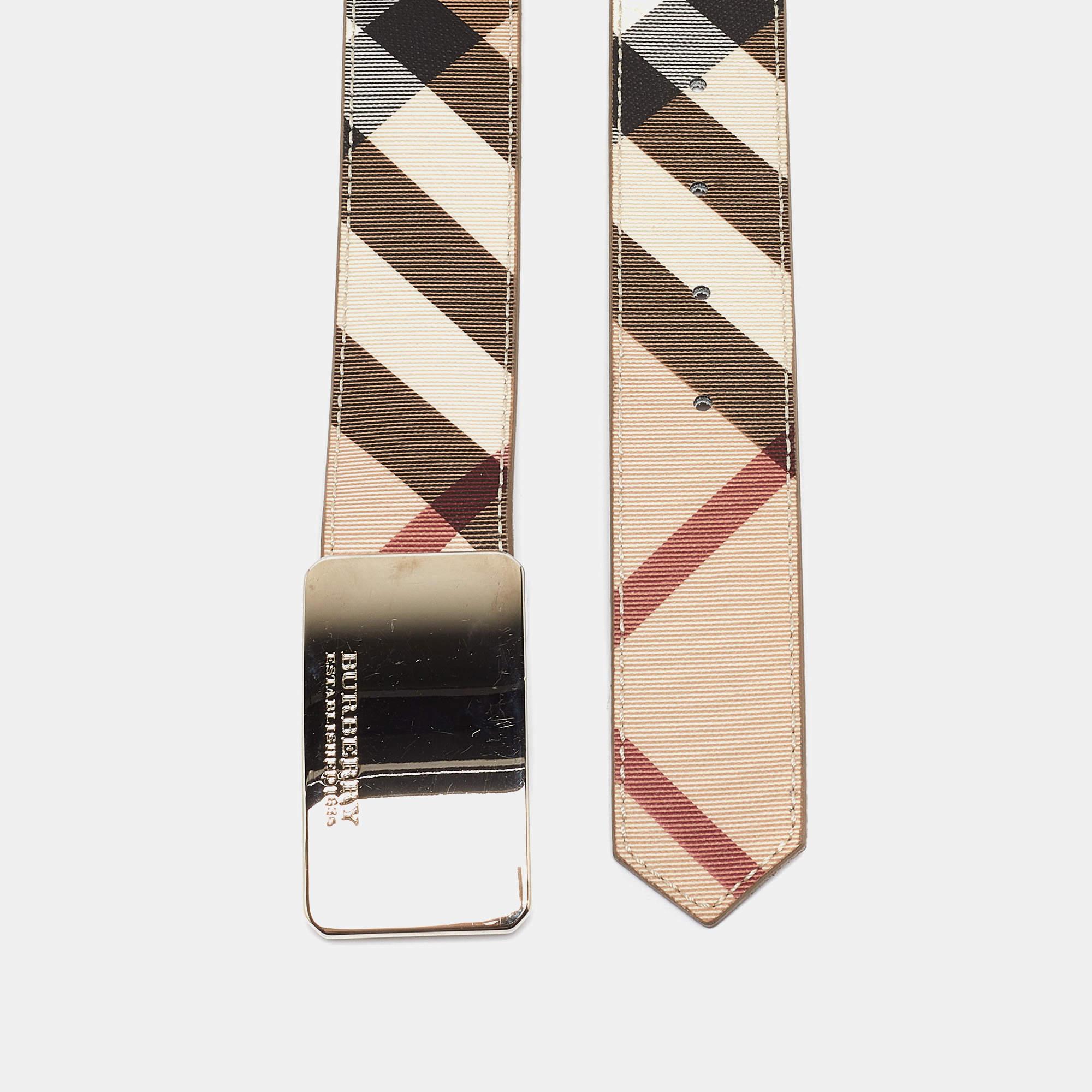 Add the labels signature style to your everyday looks with this belt from the house of Burberry. Crafted from Supernova check coated canvas and accented with leather this smart belt which is complete with silver tone buckle can be paired with your