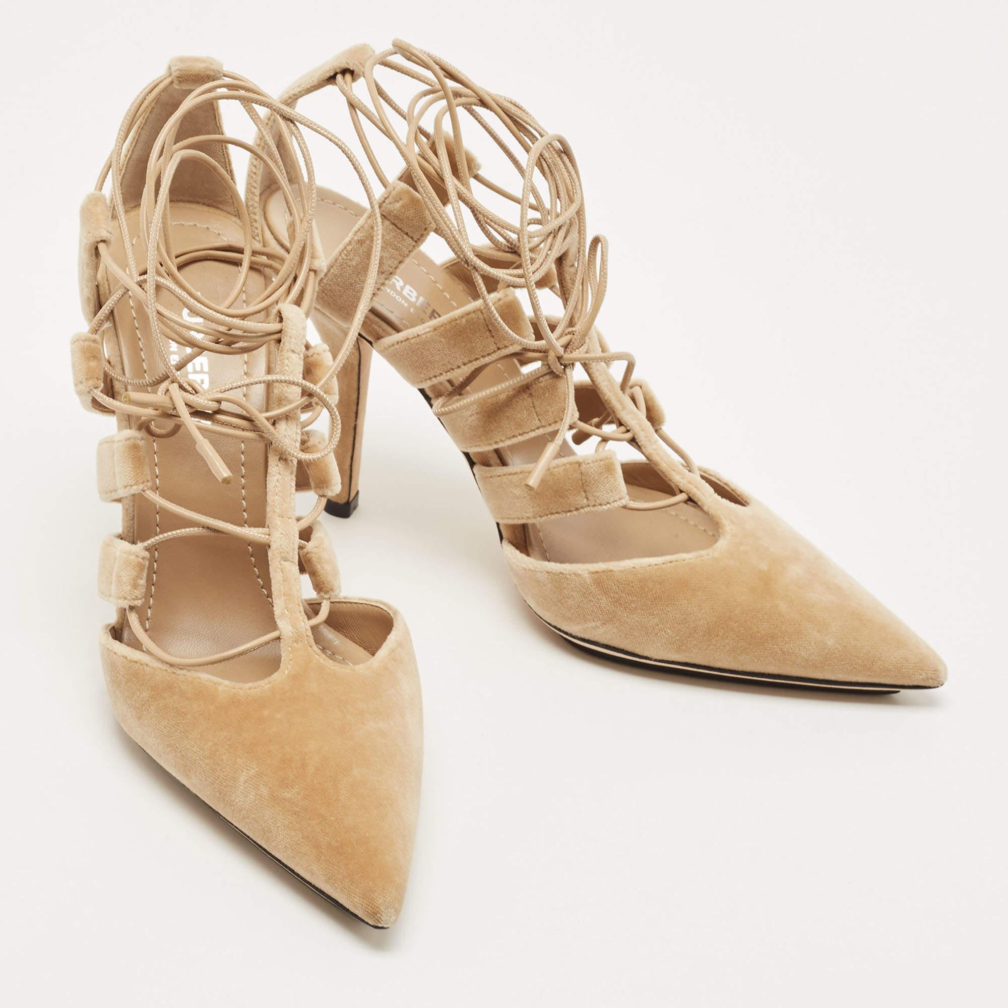 Elevate your style statement with these strappy pumps from Burberry! The pumps are crafted from velvet and added with pointed toes, tonal strings for an ankle tie design, and high heels.

