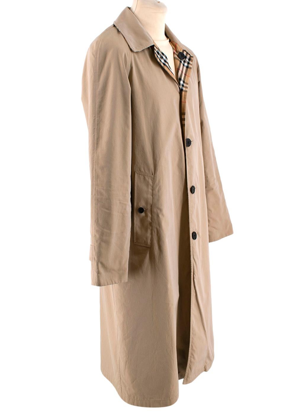 Burberry Beige & Vintage Check Reversible Trench Coat  

- Made of soft cotton 
- Classic cut 
- Reversible 
- Beige neutral hue
- Iconic signature checkered pattern 
- Pockets to the front 
- Button fastening to the front
- Timeless versatile