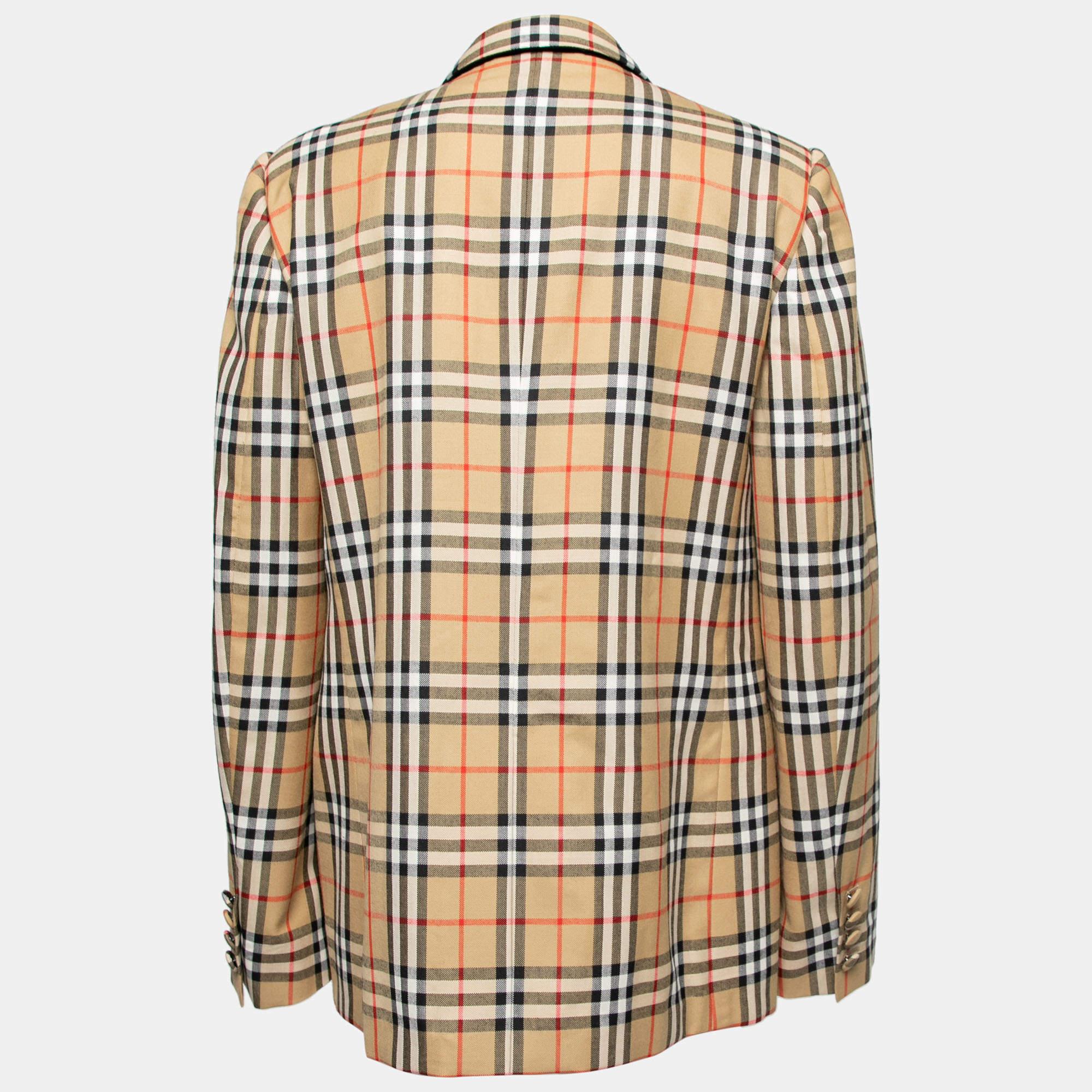 Sport a polished and suave look as you wear this smart blazer from the House of Burberry. It is cut from beige Vintage Check wool into a single-breasted silhouette. It displays buttoned closures, three pockets, and long sleeves. Pair this blazer