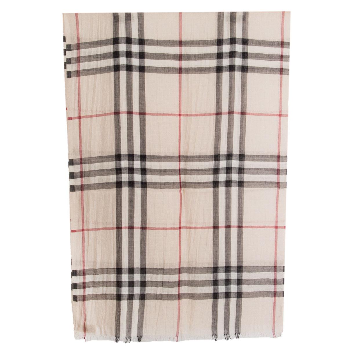 100% authentic Burberry classic check shawl in light beige, black and red virgin wool (51%) and silk (49%). Has been worn and is in excellent condition.

Height	70cm (27.3in)
Length	220cm (85.8in)

All our listings include only the listed item