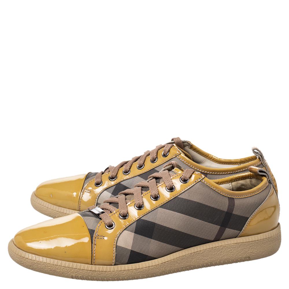 These sneakers from Burberry are truly a maker of trends. The sneakers are designed in a low-top profile using check canvas and patent leather. Finished with lace-ups and the label on the insoles, this pair is high in comfort and style, just perfect