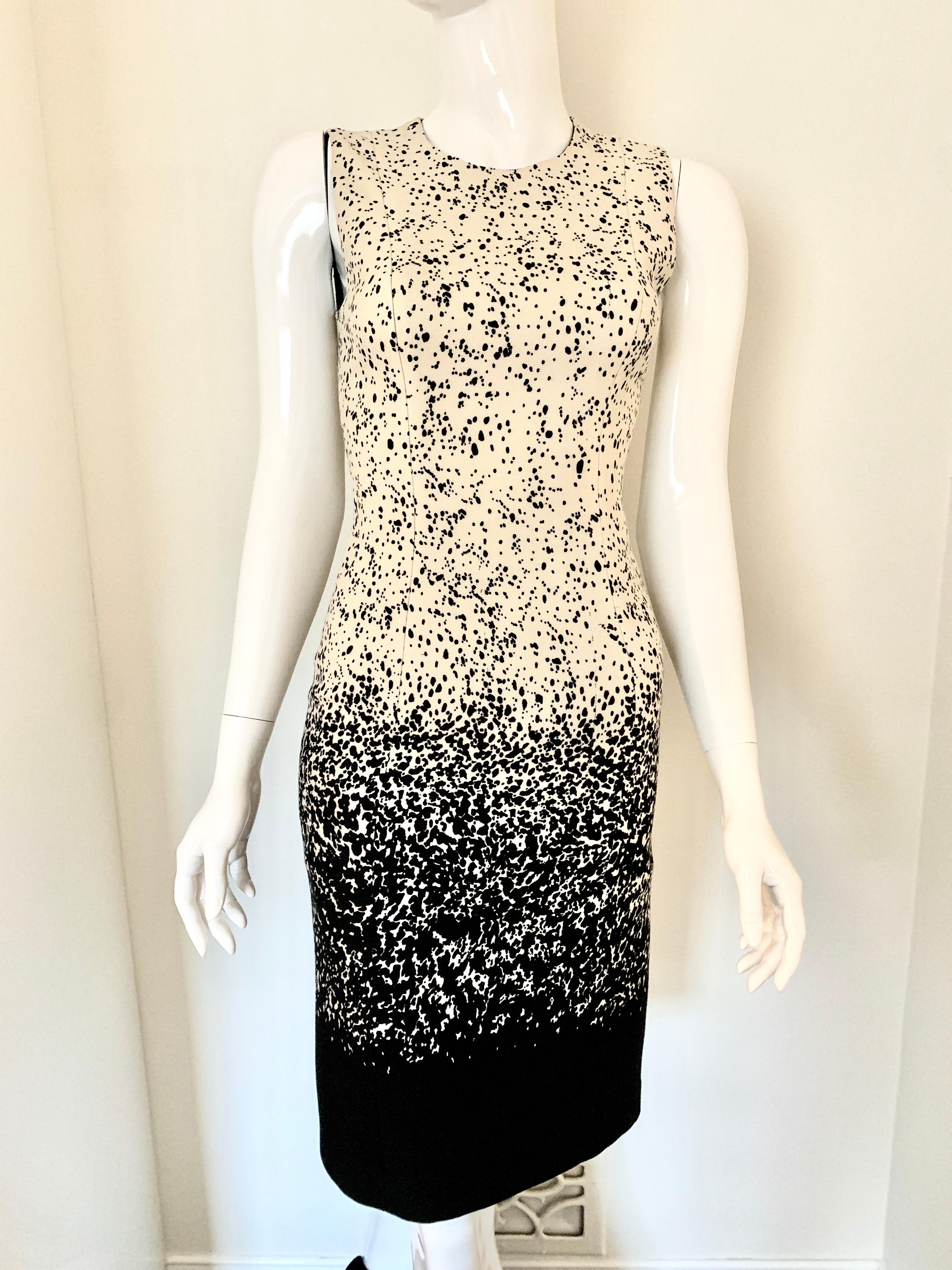 Burberry Dalmatian Sheath Dress. Perfect Day to Night Dress. 
Black and Ivory . 

Small Seam is coming out (please see photo) 
Size 38 
Made in Italy 
Hits Knee length or below (depending on height) 
100% Silk Lined

