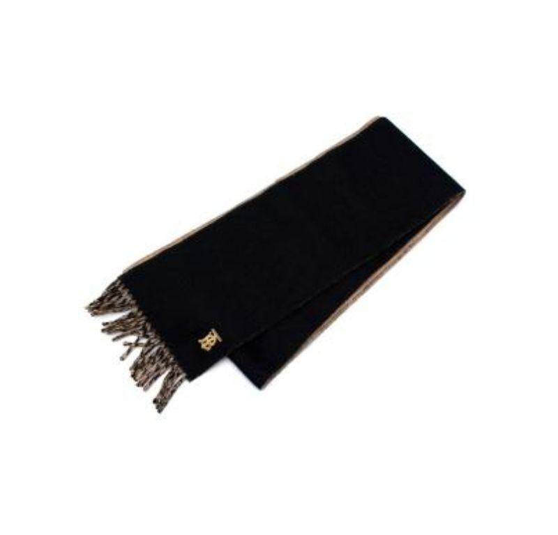 Burberry Black & Beige Cashmere Scarf with Gold Logo

- Two-tone beige and black cashmere scarf with golden TB logo in the corner 
- Tasseled ends 
- Soft felted woven cashmere 
- Hand frayed edges 
- Comes in box with tissue paper 

Made in