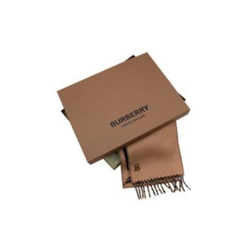 Burberry Black & Beige Cashmere Scarf with Gold Logo

- Two-tone beige and black cashmere scarf with golden TB logo in the corner 
- Tasseled ends 
- Soft felted woven cashmere 
- Hand frayed edges 
- Comes in box with tissue paper 

Made in