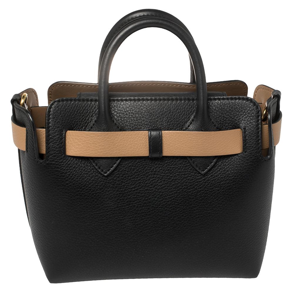 This tote is made of premium quality leather and perfects to suit all your needs. This opens up to showcase a fantastic leather-lined interior. This Burberry creation is styled with belt detail at the exterior, two top handles, a detachable shoulder