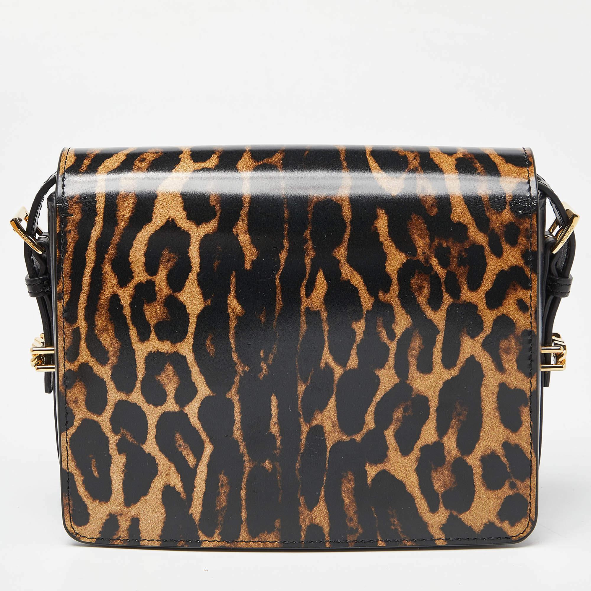 From the house of Burberry comes this gorgeous bag that will be an amazing addition to all your outfits. Luxuriously crafted from leopard-printed leather and styled with a flap closure that opens to a well-sized leather interior, the Grace bag