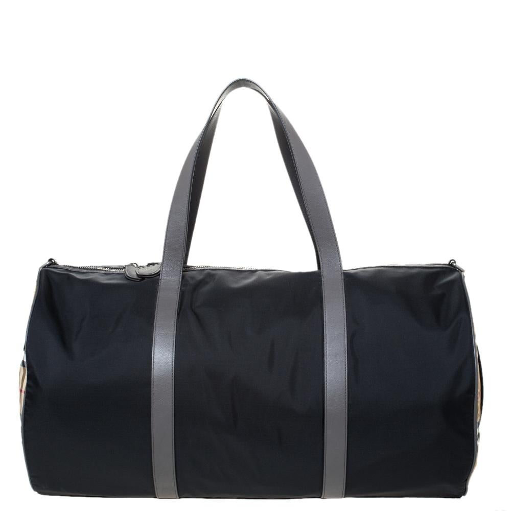 A duffel bag is an absolute wardrobe essential! This Kennedy version from the iconic house of Burberry is simple in design and has an admirable build. Crafted meticulously from quality nylon, this duffle bag comes with dual handles and a shoulder