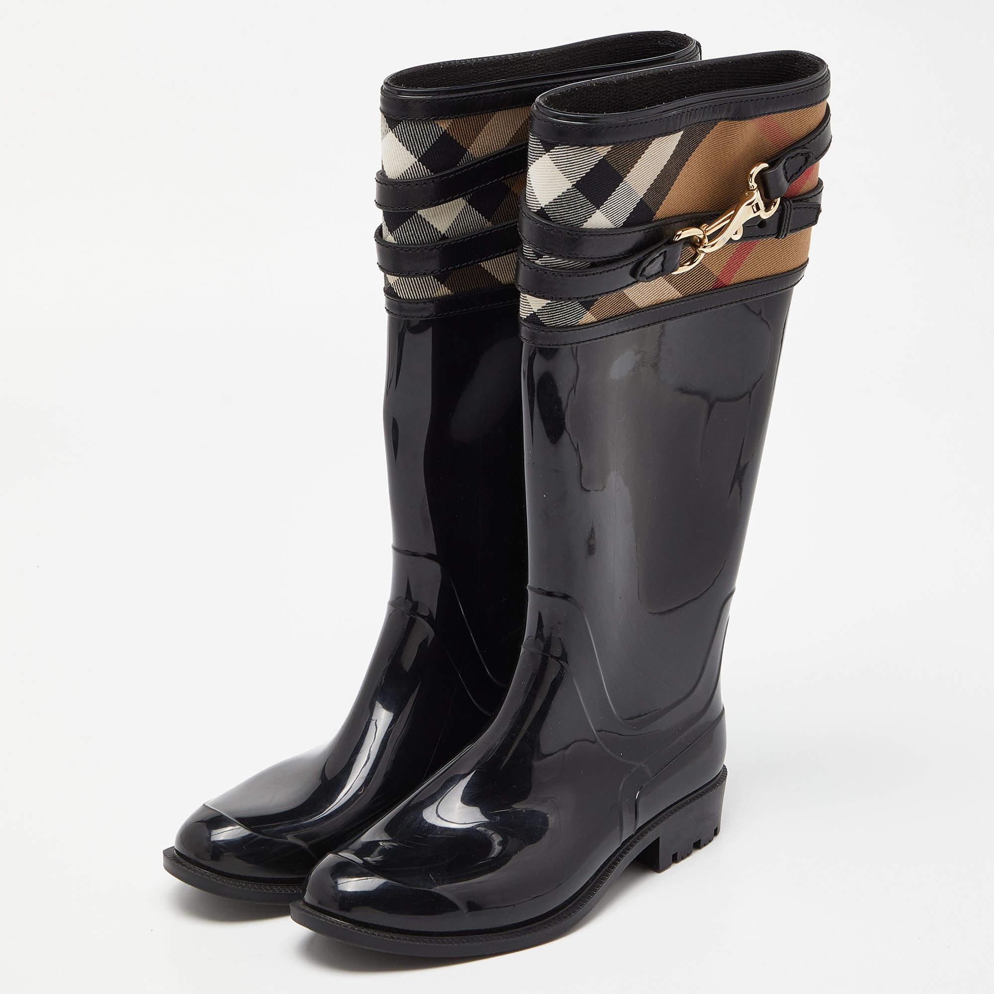 Show up on a rainy day with style in these rain boots from Burberry. They are made of rubber and styled with House Check canvas inserts and strap detailing. These boots will surely keep you dry and stylish.

