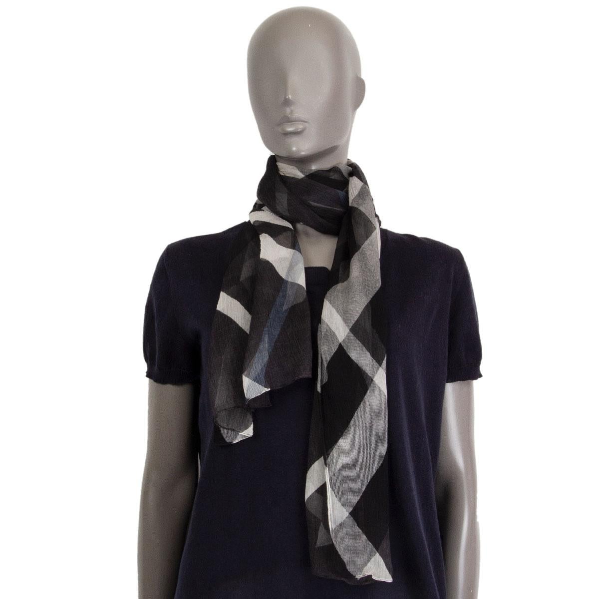 100% authentic Burberry check scarf in black, white and light blue sheer silk (missing content tag). Has been worn and is in excellent condition.

Height 45cm (17.6in)
Length 186cm (72.5in)

All our listings include only the listed item unless