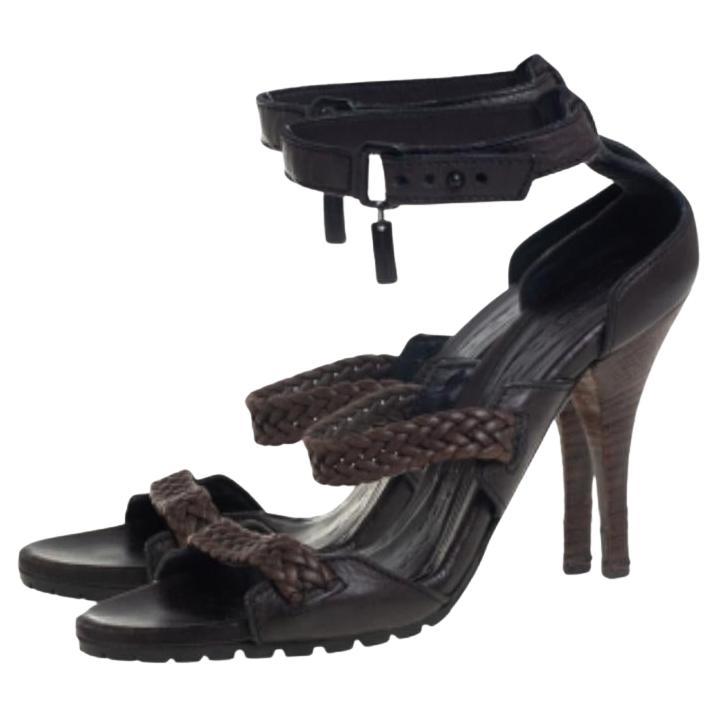 Finely crafted from the highest quality leather, these Burberry sandals come ready to give you a high-fashion experience. The brown and black sandals feature open toes, buckle ankle fastenings, and 9.5 cm heels.