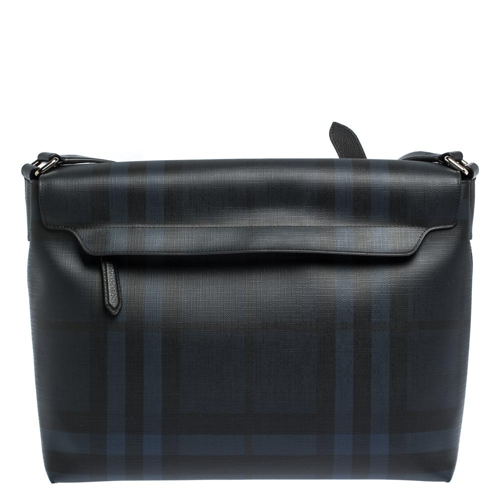 This bag from Burberry will surely assist you on all days. Crafted from Check PVC as well as leather and lined with canvas, this is a splendid pick. This luxe accessory, with a spacious interior and an adjustable shoulder strap, will make a
