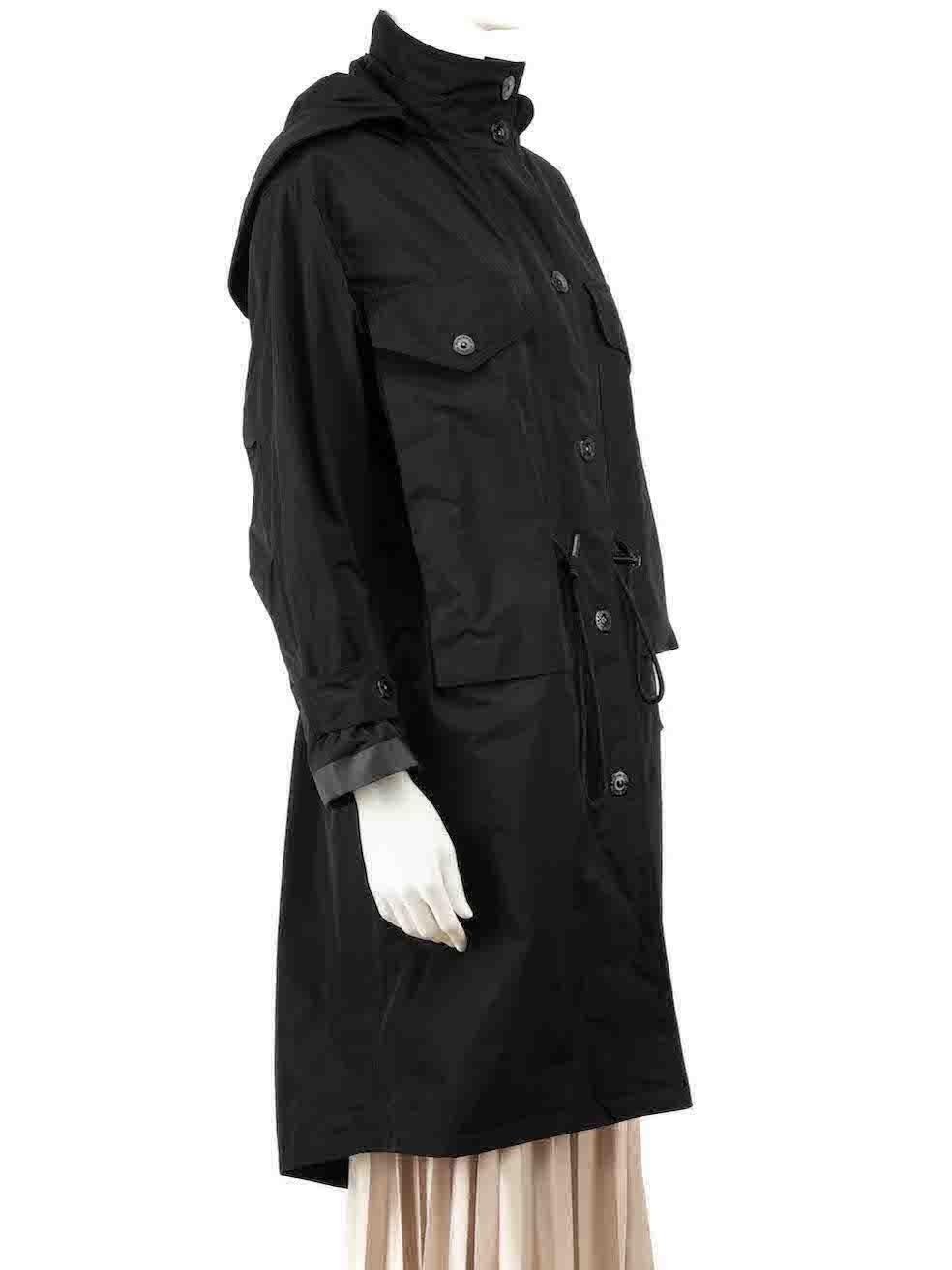 CONDITION is Very good. Minimal wear to coat is evident. Minimal wear to the front and the right sleeve with light marks on this used Burberry designer resale item.
 
 Details
 Black
 Polyester
 Parka coat
 Detachable hood
 Zip and snap button