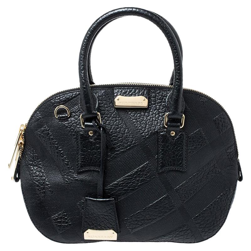 Finely crafted and richly designed, this Burberry piece is surely a must have in every woman's collection. It is made from embossed leather and features two handles and a spacious fabric interior. Quintessential for a day out with friends, this bag