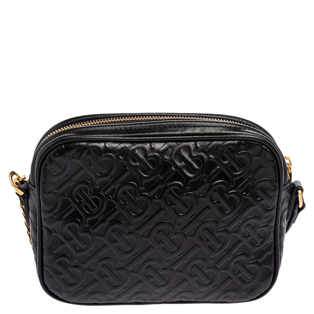 This Burberry bag is an investment piece that's on-trend now! It has been crafted from TB embossed leather in a black hue. It has an exterior zip pocket, a zip-enclosed interior, and gold-tone hardware. It is finished with a shoulder