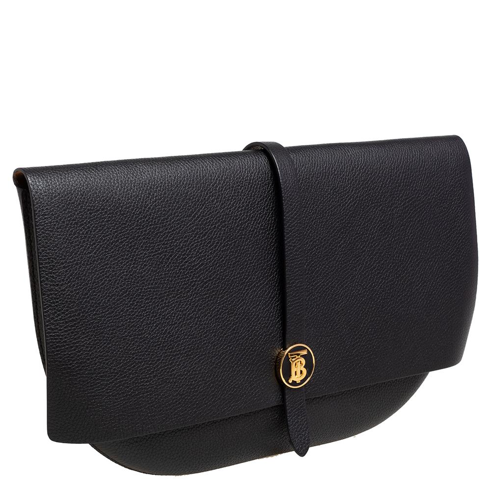 This Burberry handbag is a high-standard product that is sleek and durable. This impeccable black-grained Anne clutch is the perfect addition to your wardrobe for everyday use or special events. It is subtle, classy, and elegant to complement your