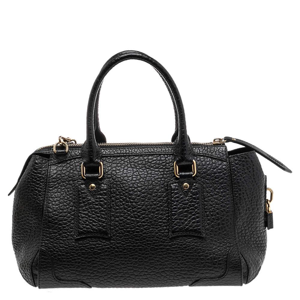 Expertly crafted and skillfully designed, this Burberry creation is a must-have in every bag collection. It is made from grained black leather and features two handles, a shoulder strap, and a spacious nylon interior.

Includes: Original Dustbag,