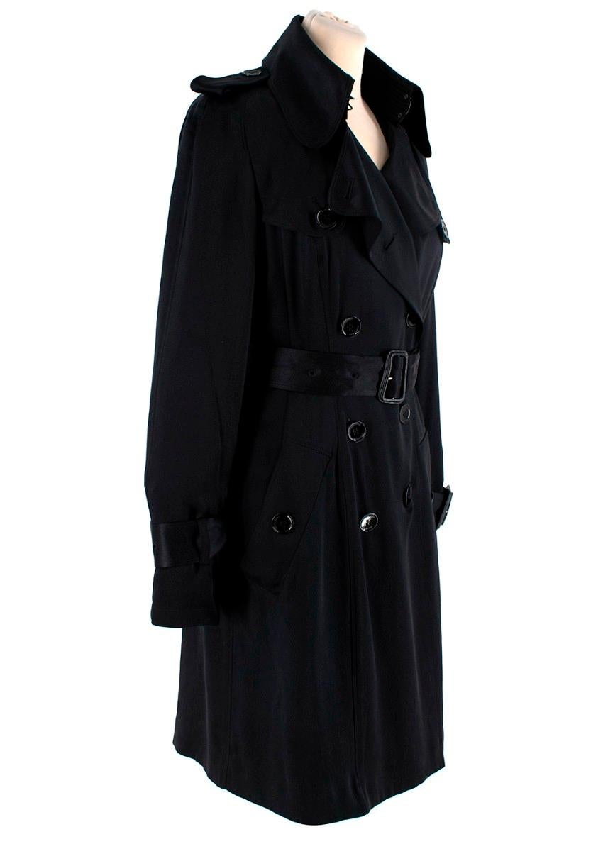 Burberry Black Silk Satin Belted Trench Coat
 

 - Lightweight trench coat in black lustrous silk satin with a slightly hammered texture, featuring all the signatue Burberry design details 
 - Fully lined 
 

 Materials:
 100% Silk
 Lining - 100%