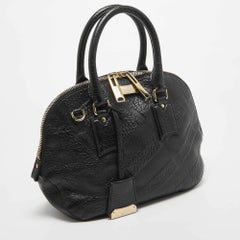 Burberry Borsa bombetta Orchard piccola in pelle nera Heritage Check Embossed