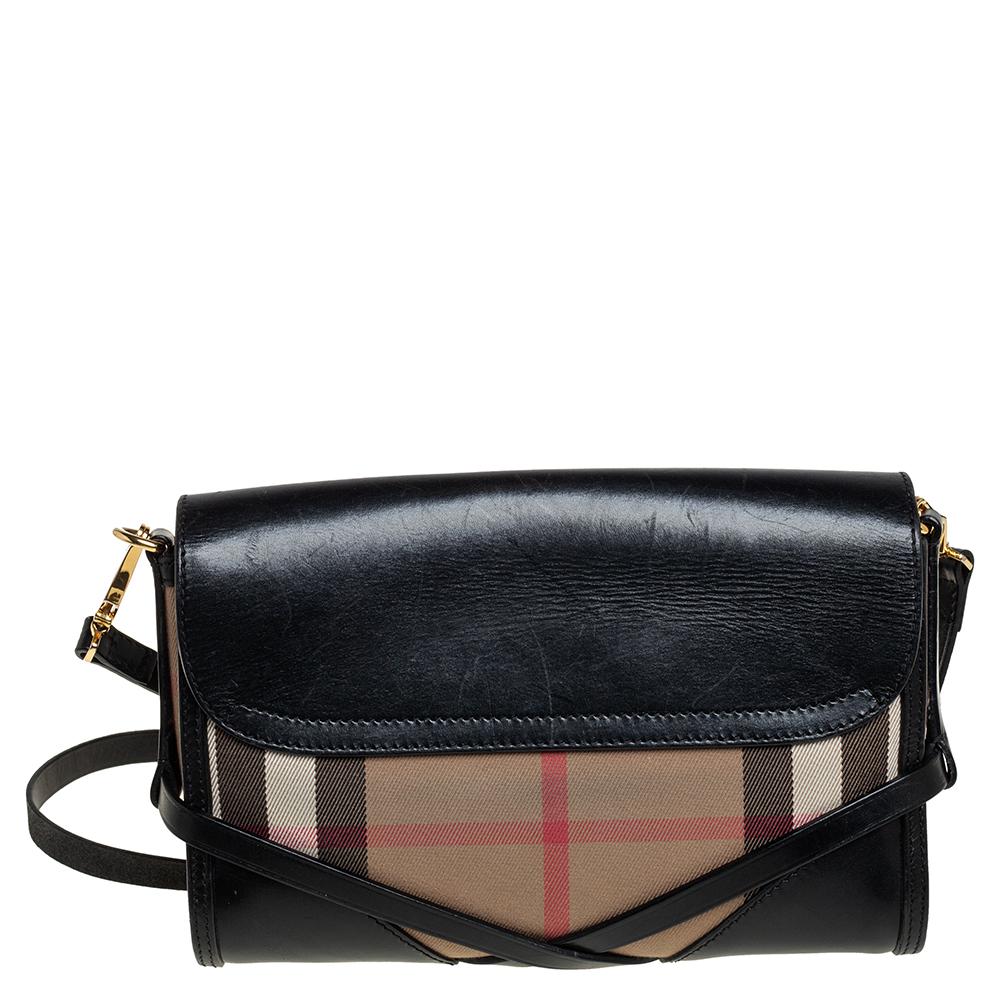 Enhance all your looks with this bag from Burberry. It has been crafted from leather and House check canvas, and it comes with a well-sized canvas interior. The exterior is made interesting with the brand label on the front flap, a shoulder strap,
