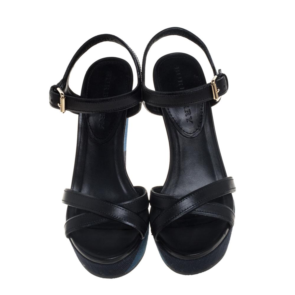 A perfect blend of comfort and style, these leather sandals are just what you need for an evening out. The crisscross strappy design adds style to the basic silhouette. This pair from Burberry comes with platforms and high wedge heels. Transform