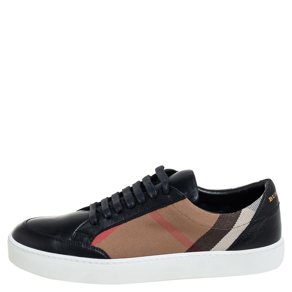 Coming with a classic low-top silhouette, these Burberry sneakers are a seamless combination of luxury, comfort, and style. They are made from House Check canvas and leather in a black shade. These sneakers are designed with round toes, laced-up