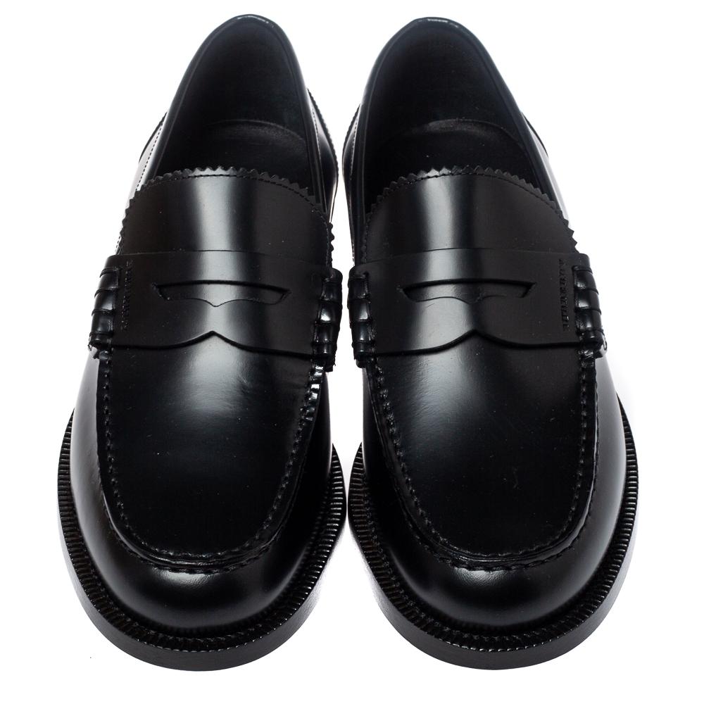 Purposely created to exude style and provide comfort wherever you go, this pair of loafers by Burberry is absolutely worth the buy! They have been finely crafted from black leather, styled with neat stitches, and finished with penny keeper