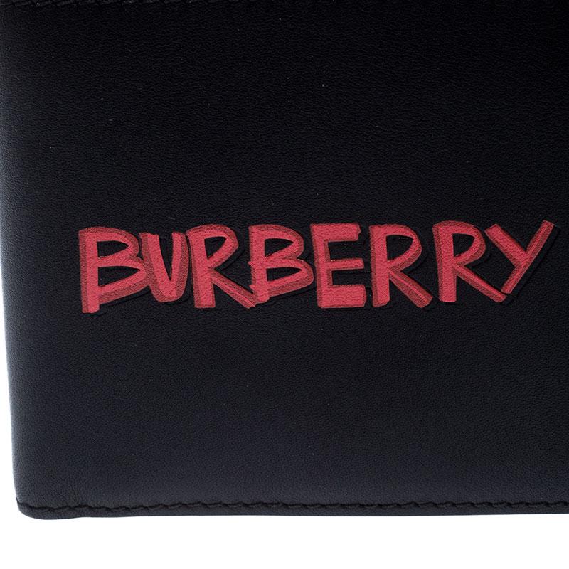This stunning wallet by Burberry is a statement piece. Crafted from leather, it comes in a classic shade of black. It features a bi-fold silhouette with a fabric interior sized with multiple card slots, side compartments and an open compartment. The