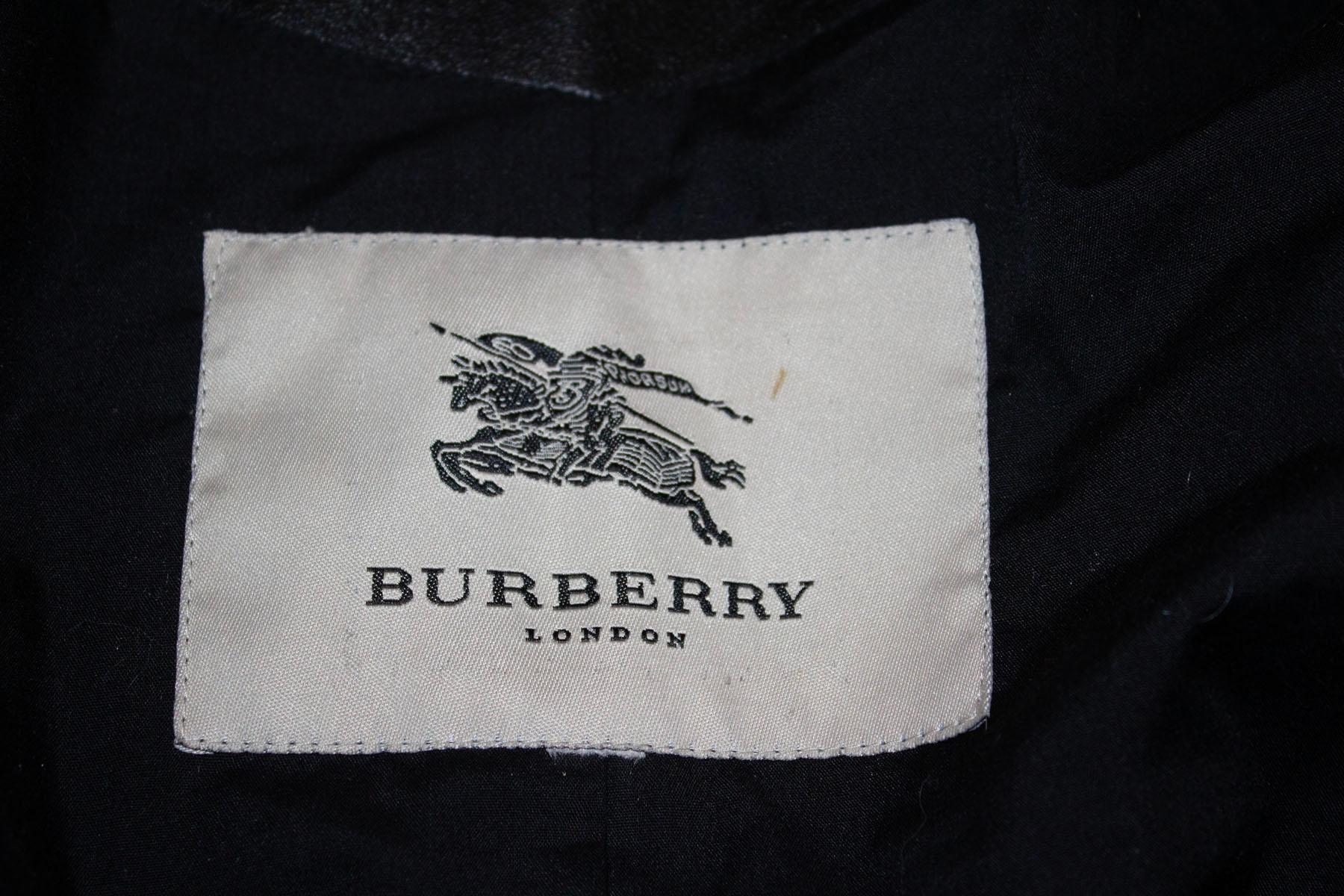 A wonderful black leather jacket by British firm Burberry. As you would expect the leather is of a wonderful quality. The jacket has a zip front opening and zip pockets. It has belt hoops at the base , epaulettes on the shoulder, zips at the wrist, 